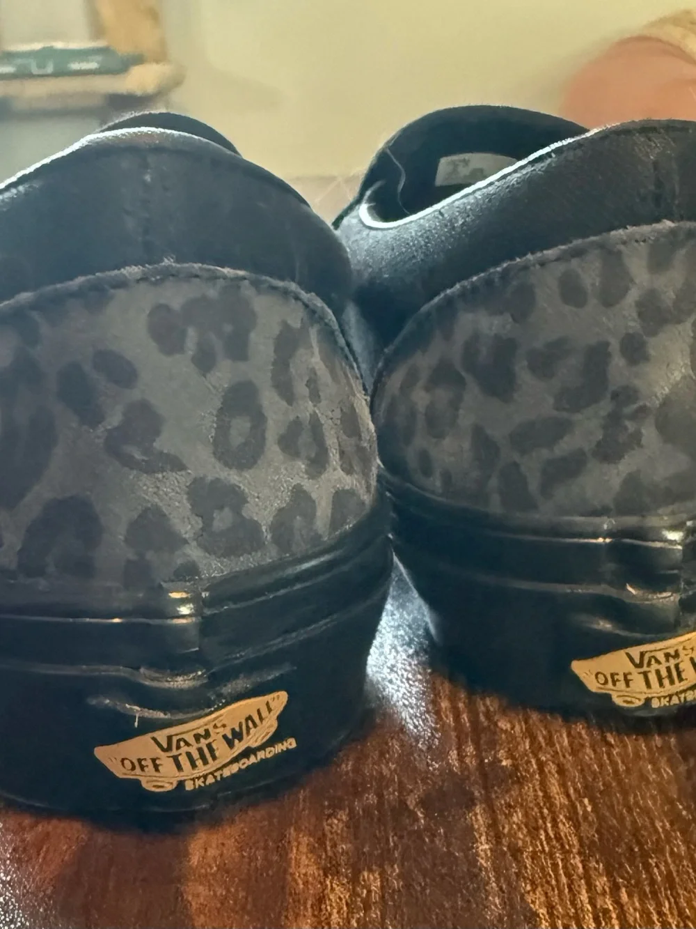 Vans Black Leopard Print Slip-On Loafers with Gold Accent